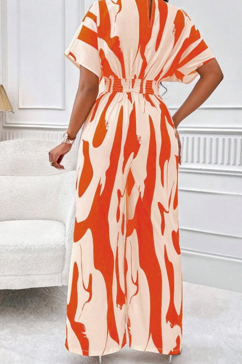 Aura Curve – Printed Wide-Leg Wrap Jumpsuit